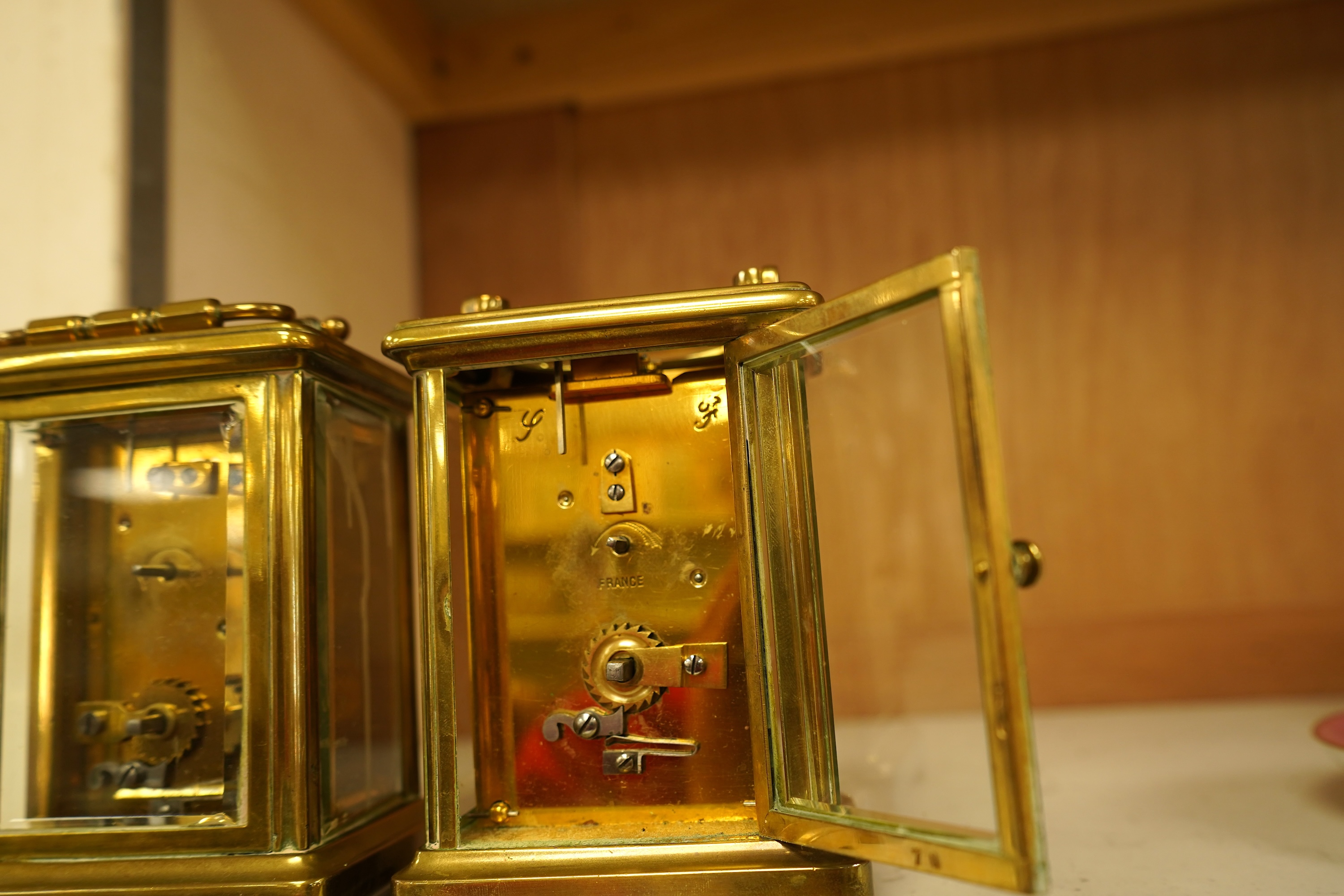 A lacquered brass champleve enamel carriage timepiece and one other, no keys, largest 15cm high